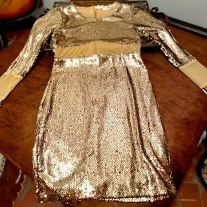 Gold sequin cocktail dress with illusion waist and arms.